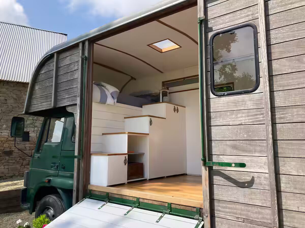 The converted vintage horsebox seen from its private courtyard